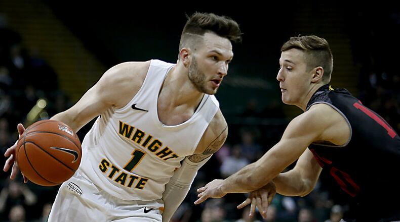 Wright State University forward Bill Wampler is covered by IUPUI guard Mike DePersia during their Horizon League game at the Nutter Center in Fairborn Sunday, Feb. 16, 2020. Wright State won 106-66. Contributed photo by E.L. Hubbard