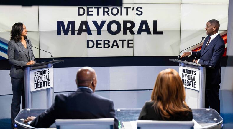 Detroit City Council President Mary Sheffield, left, and Solomon Kinloch Jr., right, face off in a televised debate between the two remaining candidates in Detroit's mayoral race on Wednesday, Oct. 15, 2025, at the WXYZ-TV studio in Southfield, Mich. (Katy Kildee/Detroit News via AP)