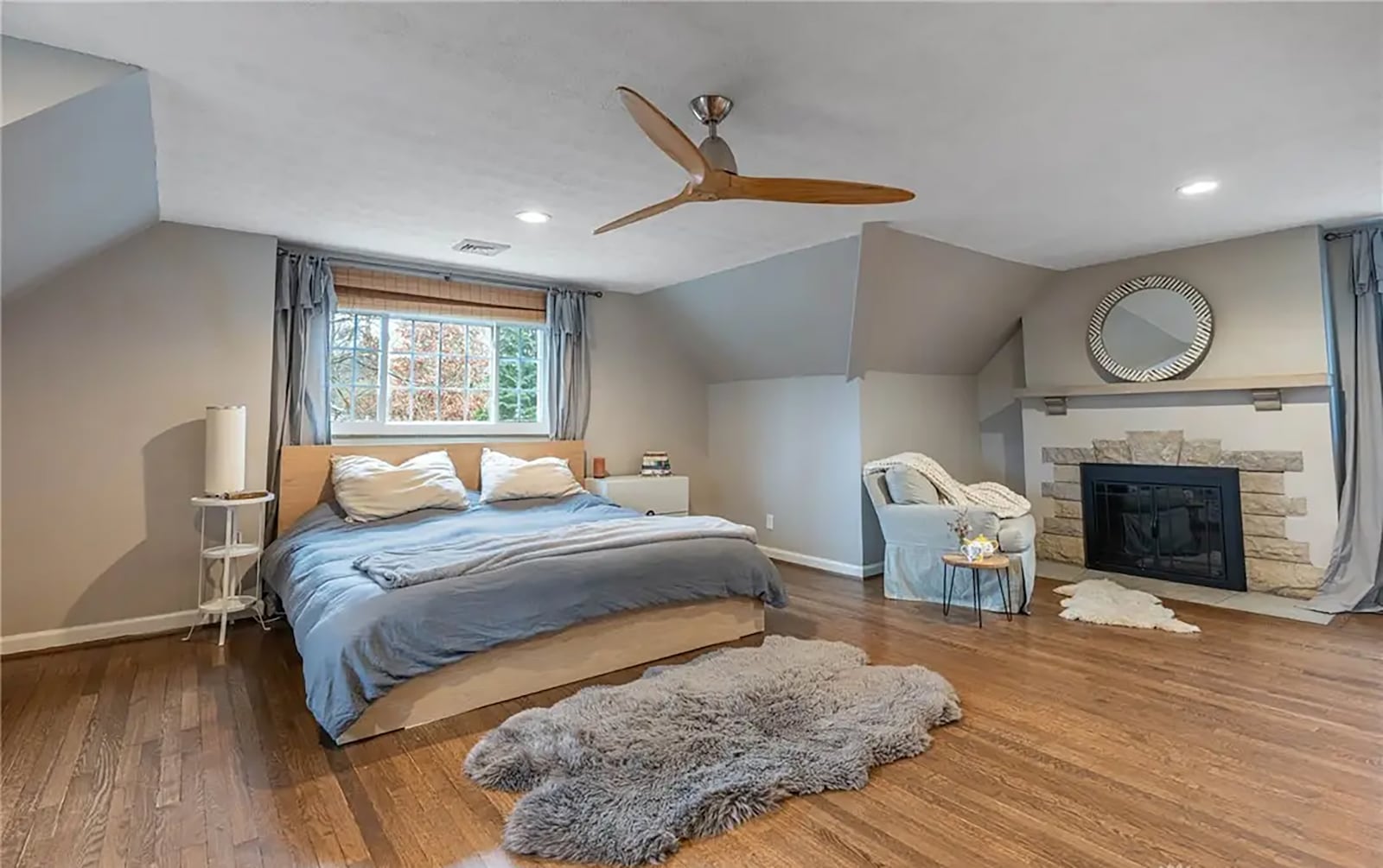 The second floor primary bedroom suite has hardwood floors, a ceiling fan and decorative fireplace. It is private with its own hallway and ensuite bathroom. CONTRIBUTED