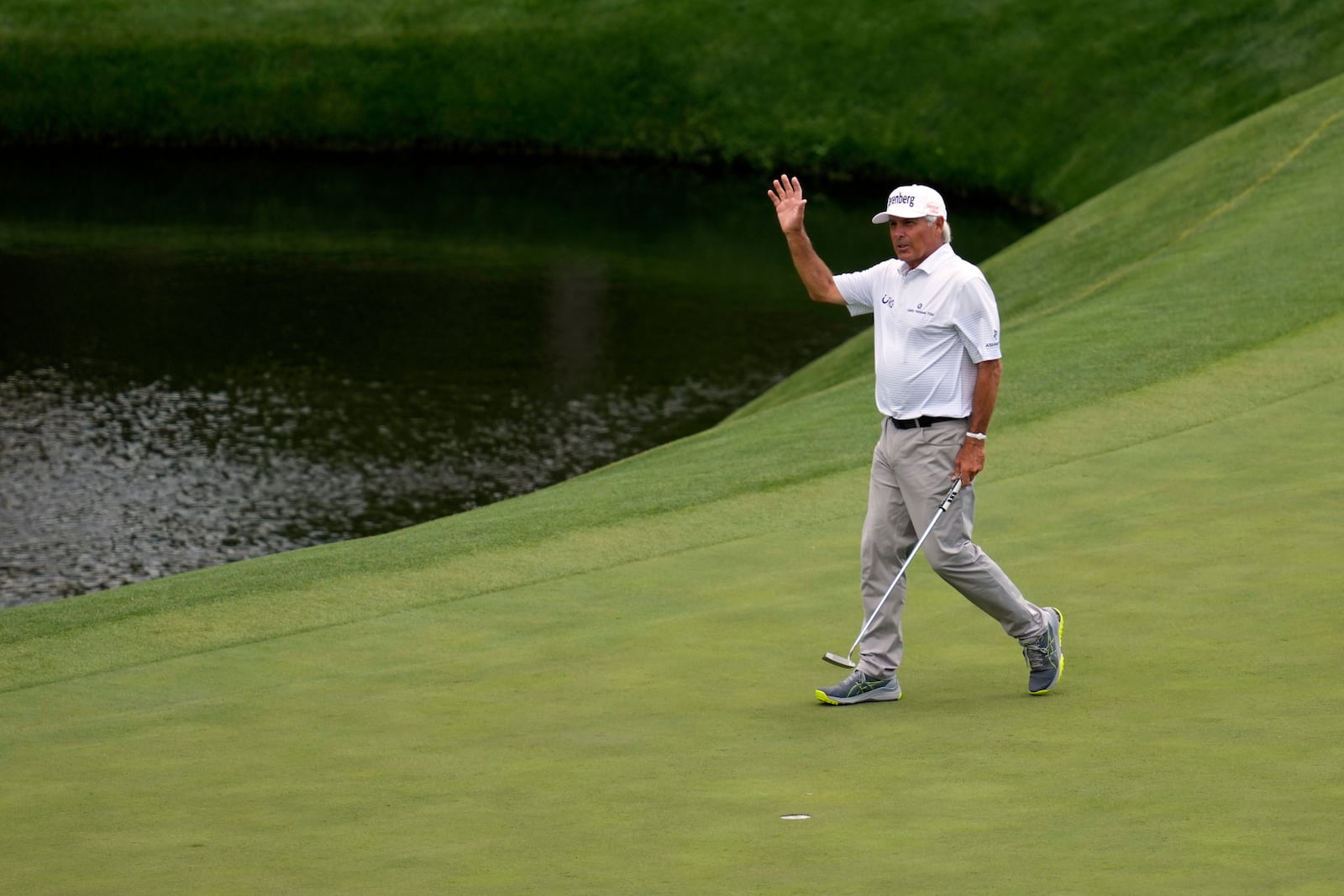 Fred Couples waves after making a putt on the 11th hole during the second round at the Masters golf tournament, Friday, April 11, 2025, in Augusta, Ga. (AP Photo/Ashley Landis)