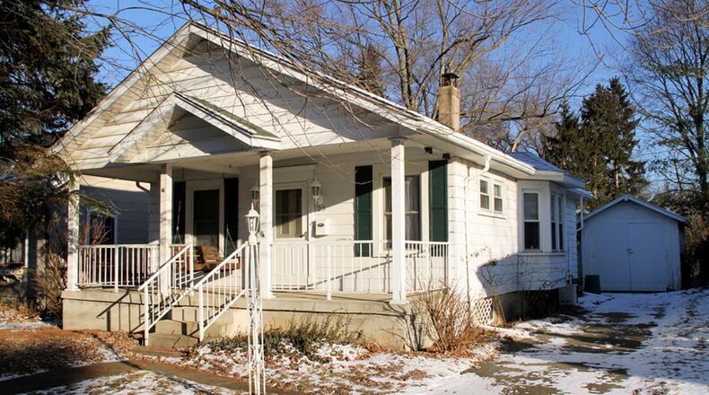 A covered front porch with swing greets guests into the 2-bedroom Cape Cod, which has an updated kitchen and bathroom. The basement has 2 rooms and egress windows. CONTRIBUTED PHOTOS BY KATHY TYLER