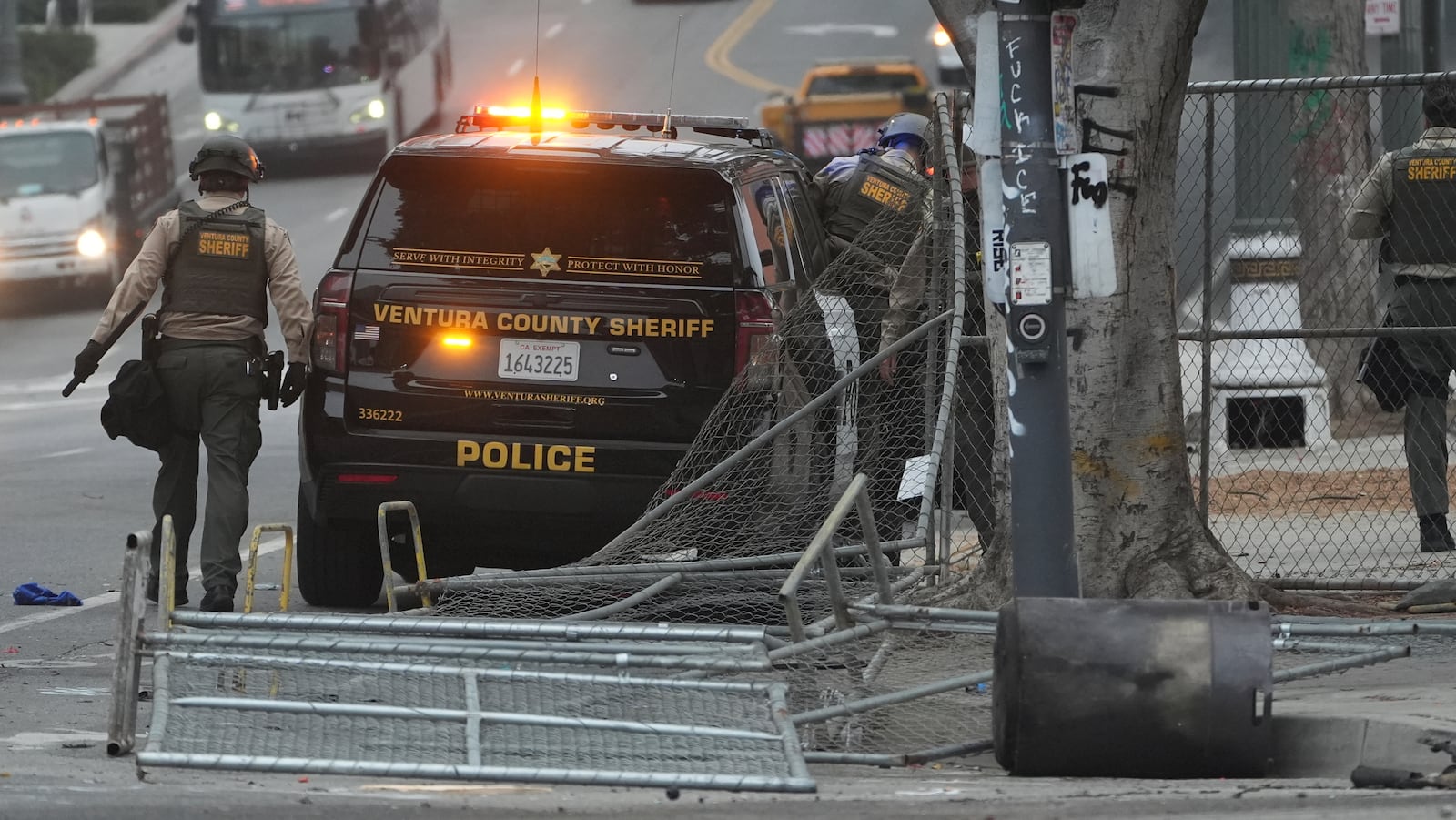 Police patrol the scene after a night of protests in downtown Los Angeles, Monday, June 9, 2025. (AP Photo/Damian Dovarganes)