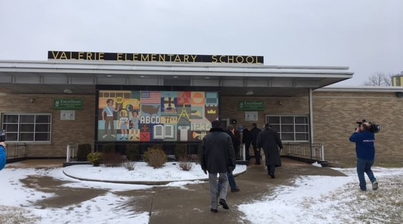 Members of a combined city-Dayton Public Schools task force studying school facilities tour Valerie Elementary School on Tuesday, Feb. 6. The tours ended before scheduled because of a legal challenge. SEAN CUDAHY/Staff
