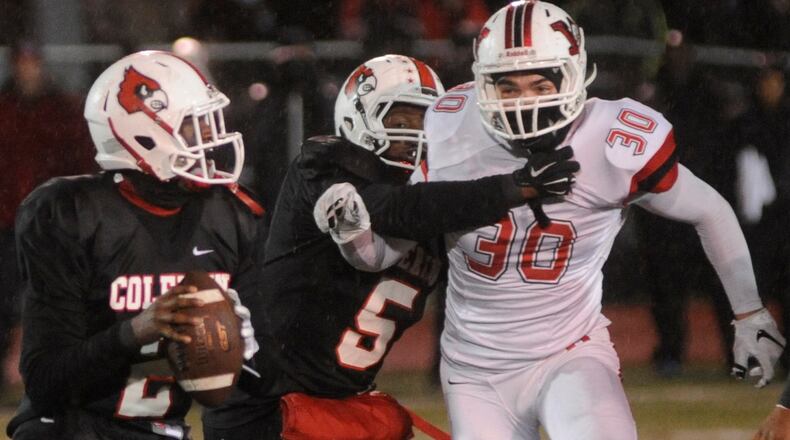 Wayne’s Alex Reigelsperger (30) closes on QB Deshaunte Jones. Wayne defeated Colerain 28-21 in a D-I high school football state semifinal at Mason on Saturday, Nov. 28, 2015. MARC PENDLETON / STAFF