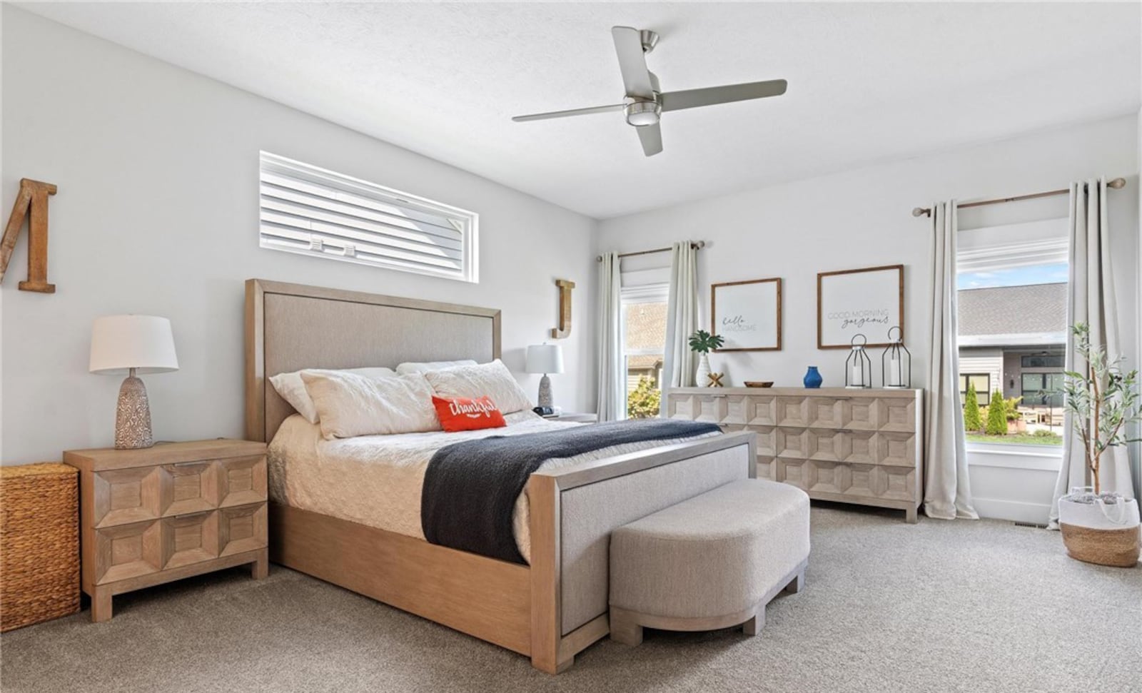 The primary bedroom suite is on one side of the home and has neutral carpeting and an ensuite bathroom. CONTRIBUTED