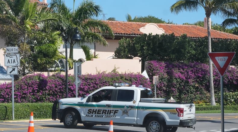 A Palm Beach County Sheriff vehicle blocks traffic near Mar-a-Lago, Sunday, Feb. 22, 2026, in Palm Beach, Fla. (AP Photo/Marta Lavandier)