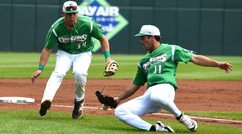Dragons pitcher Nick Sando slides to try catch a popup in front of charging third baseman Carter Graham. JEFF GILBERT/CONTRIBUTED
