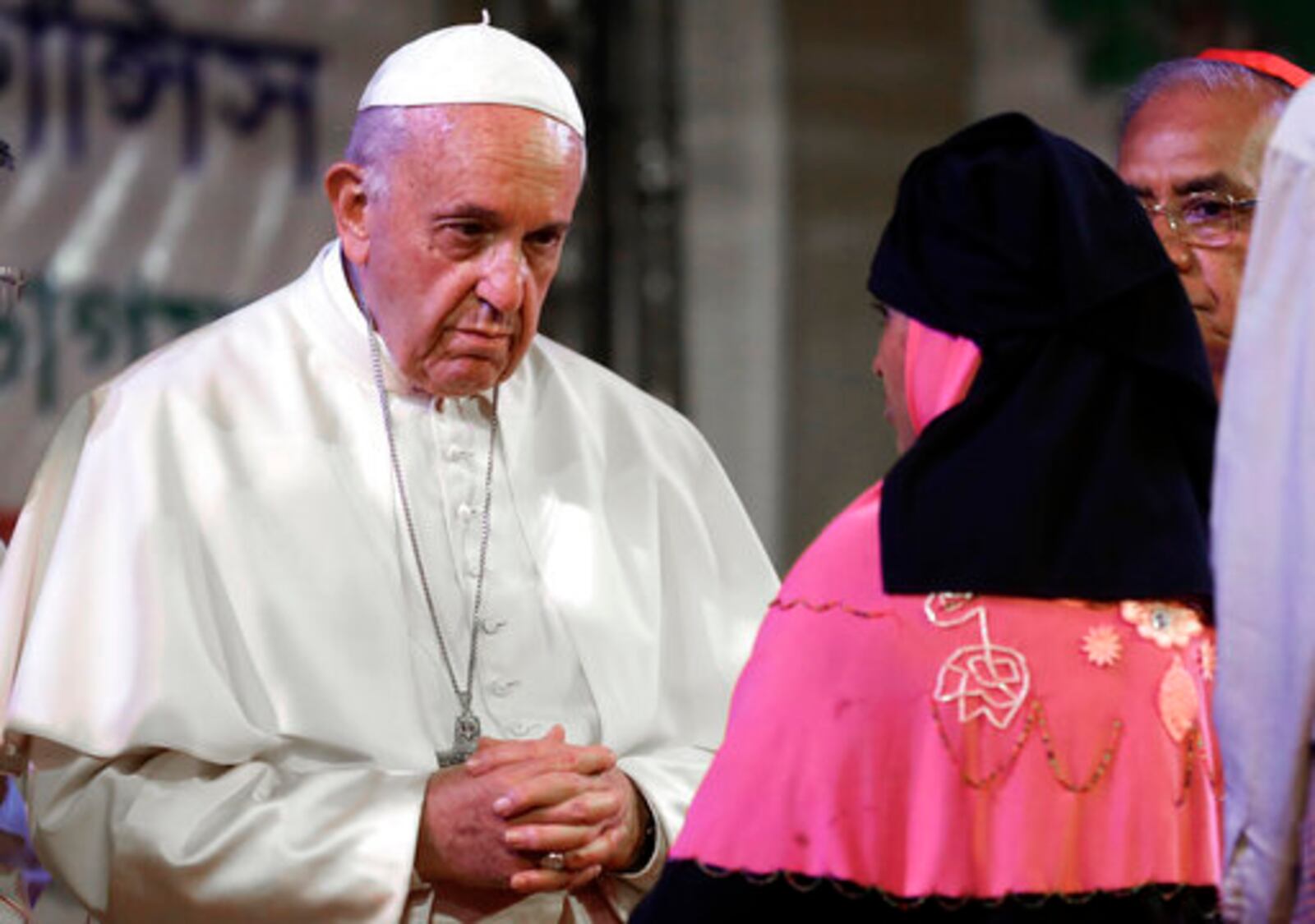 FILE - Pope Francis meets Rohingya Muslims refugees from Myanmar during an interfaith and ecumenical meeting for peace in the garden of the archbishop's residence, in Dhaka, Bangladesh, Friday, Dec. 1, 2017. (AP Photo/Andrew Medichini, file)