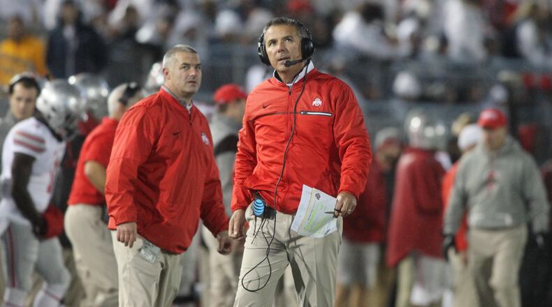 Ohio State’s Urban Meyer walks the sideline during a game against Penn State on Saturday, Oct. 22, 2016, at Beaver Stadium in State College, Pa. David Jablonski/Staff
