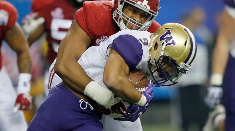 ATLANTA, GA - DECEMBER 31: Jonathan Allen #93 of the Alabama Crimson Tide tackles Myles Gaskin #9 of the Washington Huskies during the 2016 Chick-fil-A Peach Bowl at the Georgia Dome on December 31, 2016 in Atlanta, Georgia. (Photo by Kevin C. Cox/Getty Images)