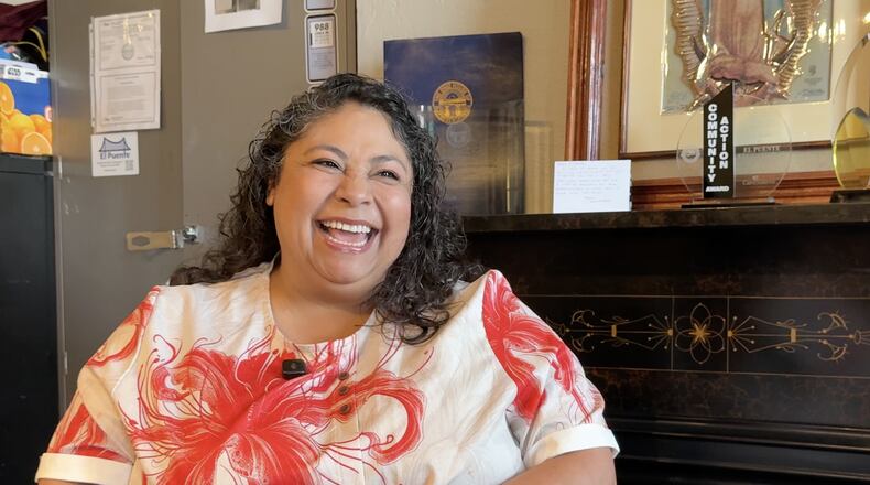 Imelda Ayala Ramos sits at El Puente, and educational service center in Dayton. STAFF/DAVID SHERMAN