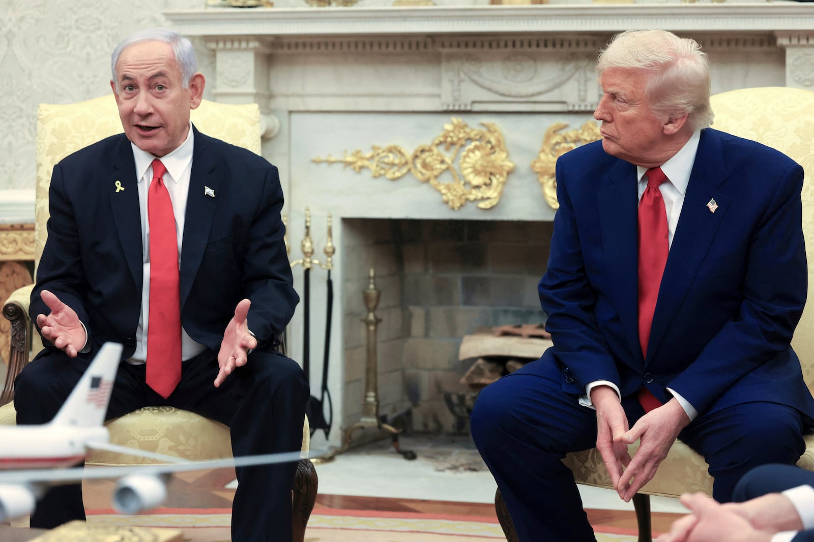 FILE - President Donald Trump, right, listens as Israel's Prime Minister Benjamin Netanyahu speaks during a meeting in the Oval Office at the White House in Washington, April 7, 2025. (Pool via AP, file)