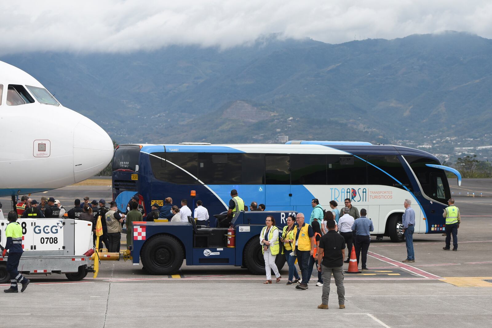 FILE - A bus carrying migrants from Central Asia and India, deported from the United States, arrives at the Juan Santamaría International Airport in San Jose, Costa Rica, Feb. 20, 2025. (AP Photo/Jose Diaz, File)