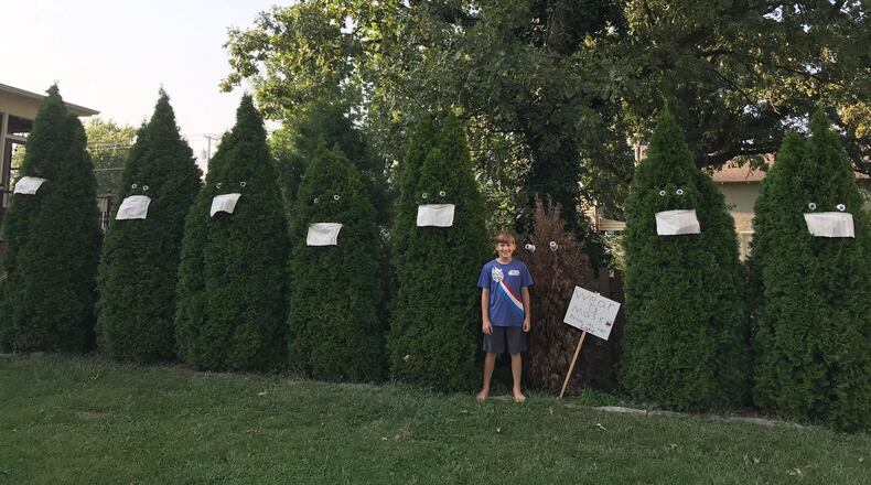 Tony Fomin, fifth-grader at William Bruce Elementary School, stands with his art instillation in front of his Eaton home. CONTRIBUTED