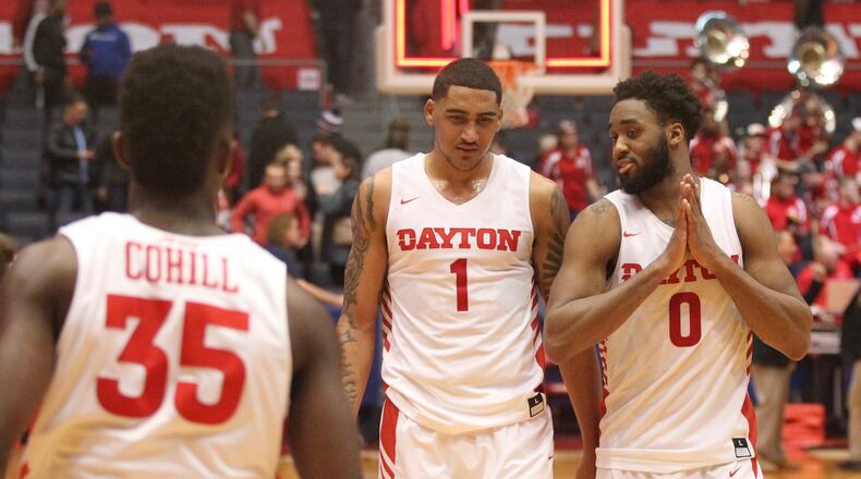 Dayton’s Obi Toppin and Josh Cunningham talk as they leave the court after a victory against Richmond on Jan. 6, 2019, at UD Arena. David Jablonski/Staff