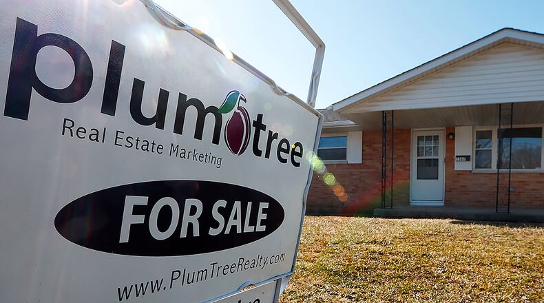 A sign advertises a house for sale on Woodman Drive in Riverside in late February. There were 905 home sales reported in February, an 18.3% decrease compared to February 2024, according to Dayton Realtors Multiple Listing Service. MARSHALL GORBY/STAFF