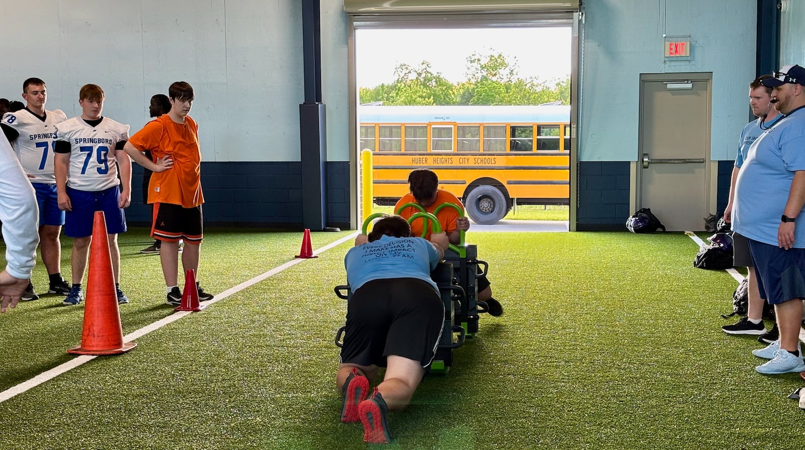 Offensive linemen work out at a high school football 7 on 7 in Fairborn on May 19, 2025.