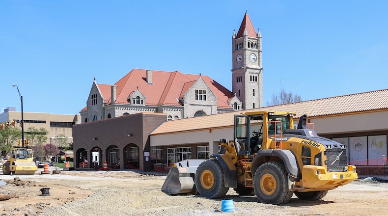 In this April file photo, a bulldozer is parked on the grounds of the Xenia Market District development, with the Greene County Courthouse visible in the background. BRYANT BILLING / STAFF