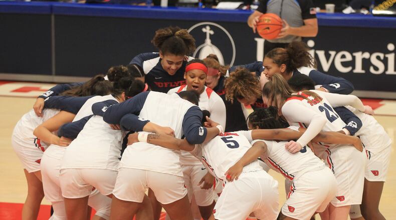 Dayton huddles before a game against Toledo on Wednesday, Nov. 17, 2021, at UD Arena. David Jablonski/Staff