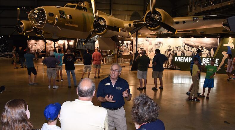 Don Meyer, a National Museum of the U.S. Air Force tour guide, tells a group of museum guests about the Memphis Belle exhibit. (U.S. Air Force photo)