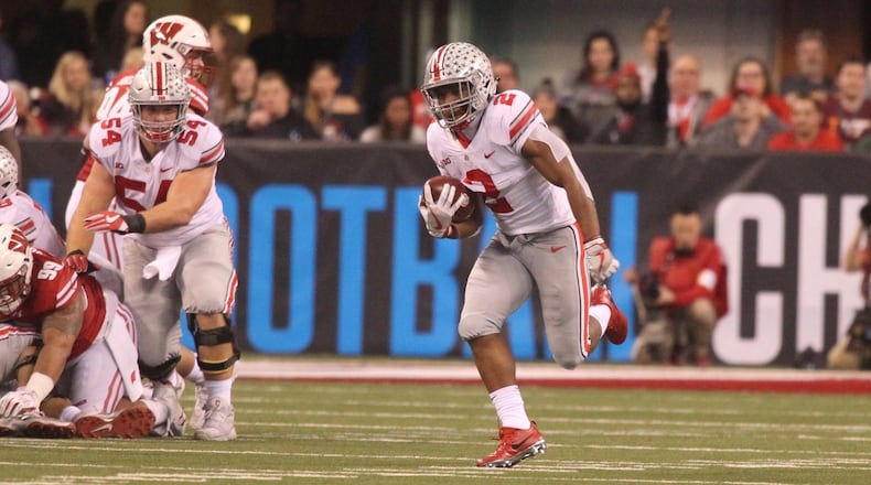 Ohio State’s Billy Price, left, blocks for J.K. Dobbins against Wisconsin on Saturday, Dec. 2, 2017, at Lucas Oil Stadium in Indianapolis. David Jablonski/Staff