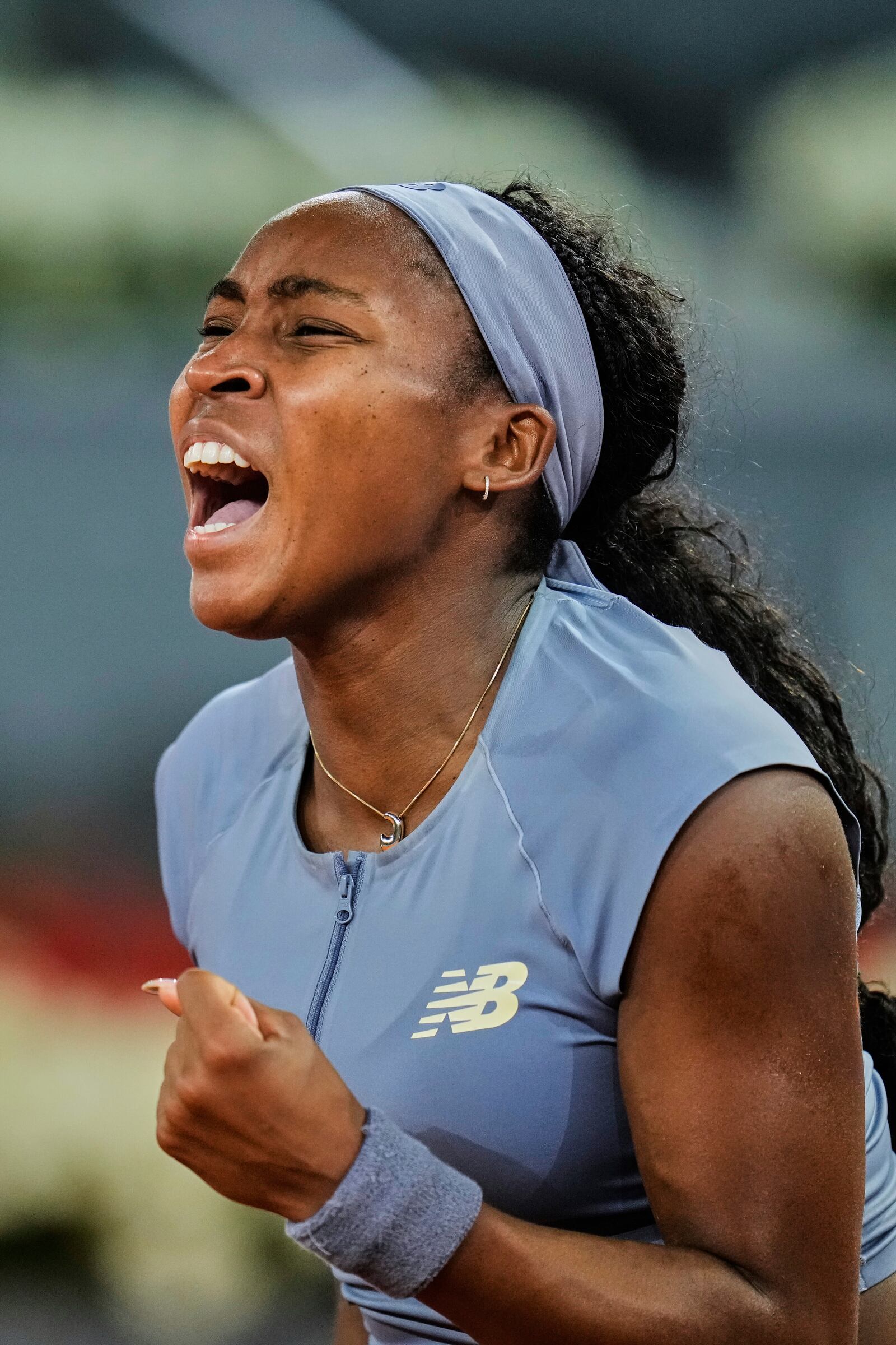United States' Coco Gauff celebrates after her win over Ukraine's Dayana Yastremska at the Madrid Open tennis tournament in Madrid, Spain, Thursday, April 24, 2025. (AP Photo/Manu Fernandez)