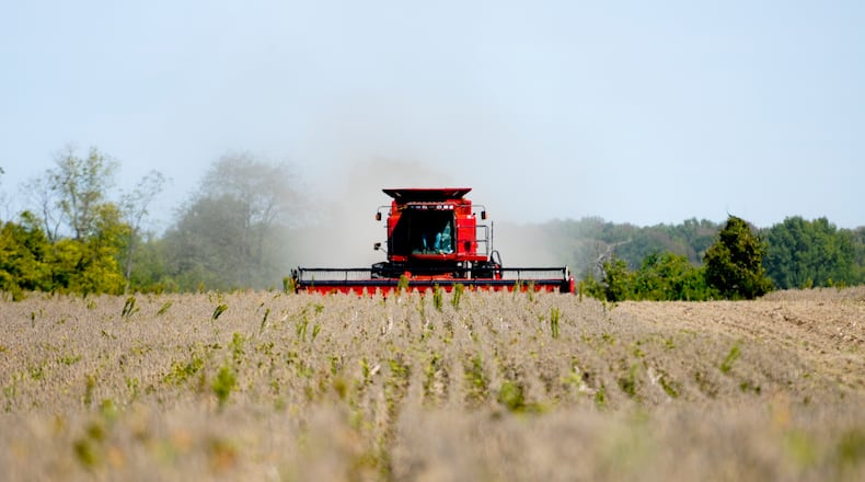 Bob Minges harvests a field of soy beans Monday, Sept. 24, 2012 in Morgan Twp. in Butler County. Minges, along with his brother Larry and sons, Greg and Brad, farms over 2000 acres of mostly corn and soybeans. "This is the worst year we have ever had," said Minges. Staff photo by Nick Graham