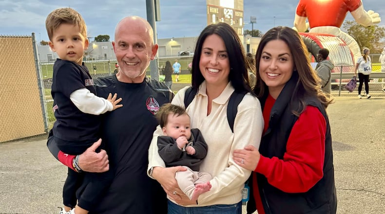 Before last Friday’s game, Northridge football coach Bob Smith with his family. He’s holding his 2-year-old grandson Calvin, his daughter Chelsea is holding her daughter Quinn and next to her is his daughter Kristin, who is Calvin’s mom. CONTRIBUTED