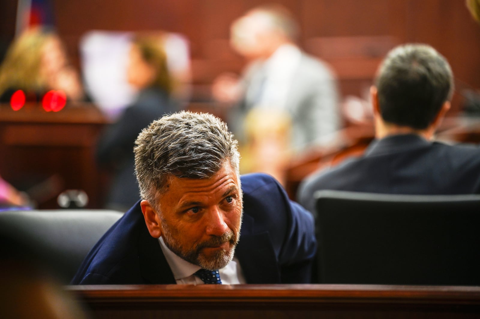 Ryan Brackley, a lawyer for the prosecution, talks with his staff before delivering his opening arguments during the murder trial for James Craig, accused of killing his wife, at the Arapahoe District Court, Tuesday, July 15, 2025, in Centennial, Colo. (Stephen Swofford via Denver Gazette, Pool)