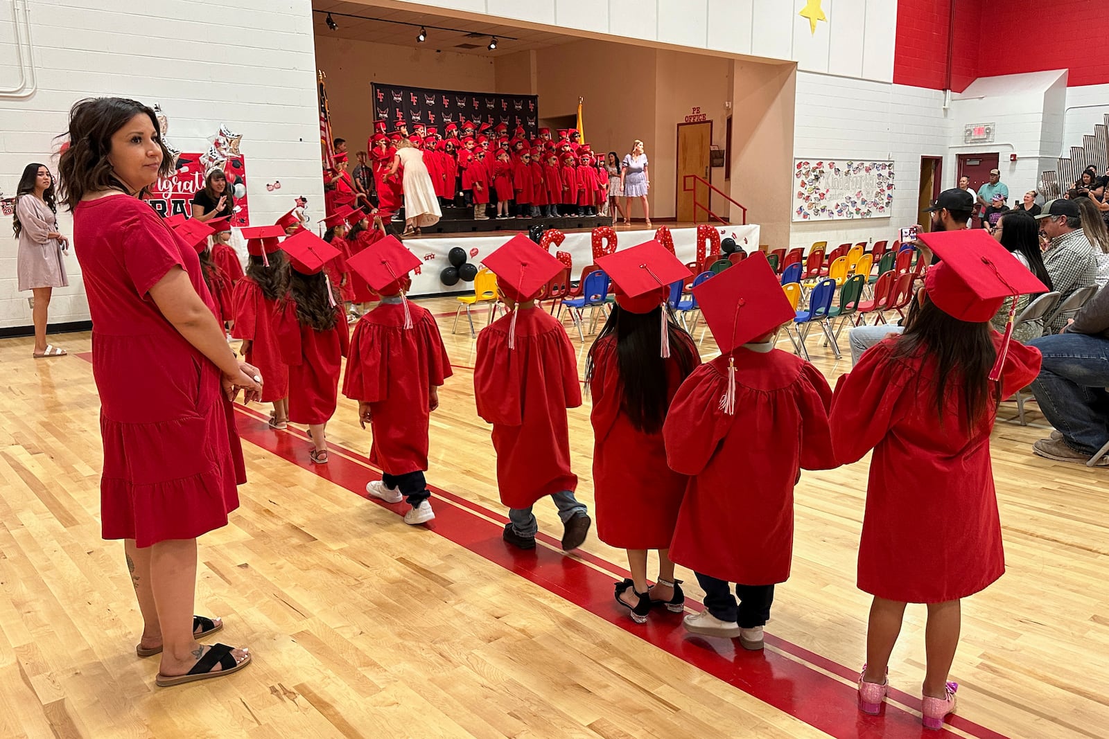 Kindergartners at Loving Elementary School line up for a procession during their graduation ceremony in Loving, N.M., on Tuesday, May 20, 2025. (AP Photo/Susan Montoya Bryan)