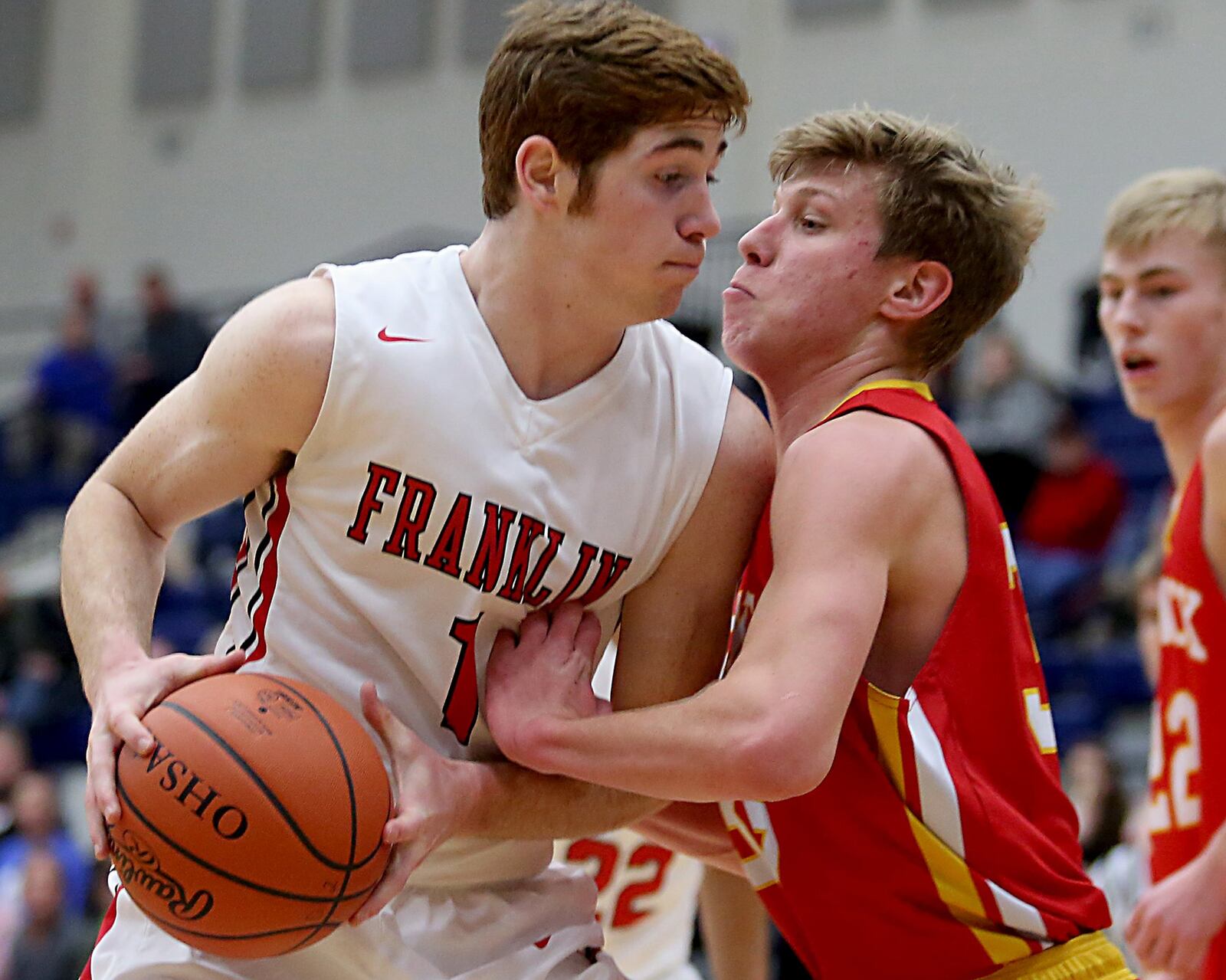 Franklin forward Noah Kremer (left) gets up close and personal with Fenwick’s Luke Bradshaw during Saturday’s Division II sectional game at Fairmont’s Trent Arena. CONTRIBUTED PHOTO BY E.L. HUBBARD