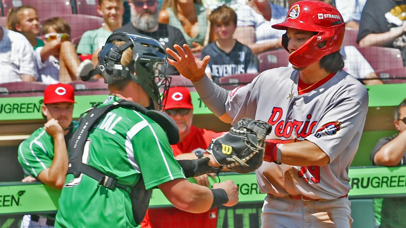 Dragons catcher Ryan McCrystal tags out Jon Jon Gazdar in a third-inning rundown to help the Dragons beat Peoria 3-2 in 11 innings Sunday at Day Air Ballpark. JEFF GILBERT/CONTRIBUTED