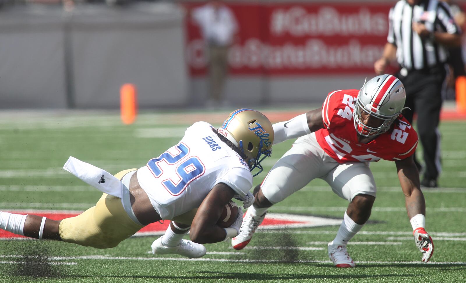 Ohio State’s Malik Hooker, right, defends Tulsa’s Justin Hobbs on Saturday, Sept. 10, 2016, at Ohio Stadium in Columbus. David Jablonski/Staff