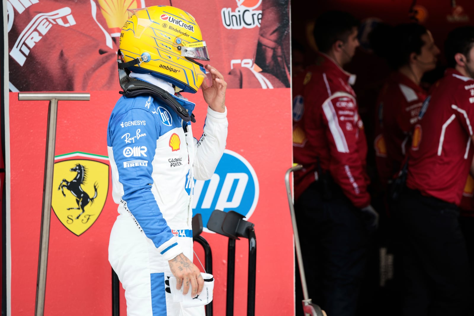 Ferrari driver Lewis Hamilton of Britain reacts after being eliminated during the qualifying session for the Formula One Miami Grand Prix auto race at the International Autodrome, Saturday, May 3, 2025, in Miami Gardens, Fla. (Shawn Thew/Pool Photo via AP)