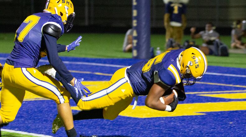 Springfield's Terell Jackson falls into the end zone for a touchdown after recovering a fumbled punt. The score gave Springfield a 27-7 lead in its 27-21 victory over Fairmont on Friday night in Springfield. Jeff Gilbert/CONTRIBUTED