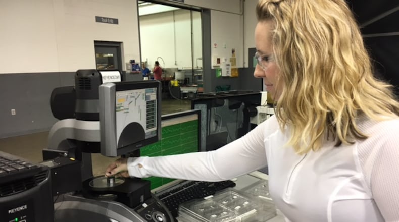 Veteran Norwood Medical employee Becca Hummer inspects parts in this March 2017 file photo. THOMAS GNAU/STAFF