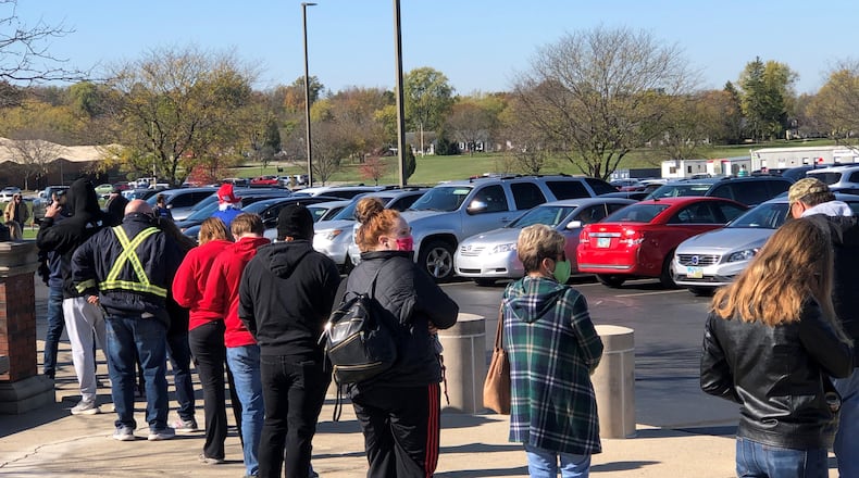 More than 50 people were in a line Monday morning for early voting at the Warren County Board of Elections office. The line stretched along front of common pleas court and parking lot. Ohio’s early voting ends at 2 p.m. Monday, Nov. 2, 2020. LAWRENCE BUDD/STAFF