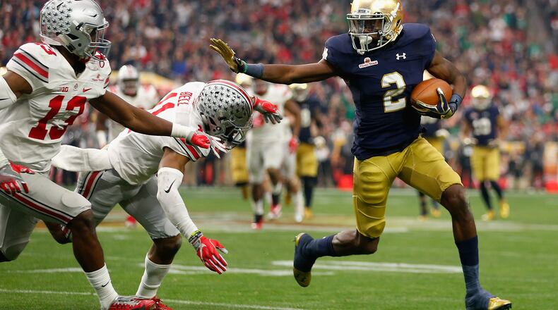 GLENDALE, AZ - JANUARY 01: Wide receiver Chris Brown #2 of the Notre Dame Fighting Irish runs with the football against safety Vonn Bell #11 of the Ohio State Buckeyes (back) and cornerback Eli Apple #13 (front) during the third quarter of the BattleFrog Fiesta Bowl at University of Phoenix Stadium on January 1, 2016 in Glendale, Arizona. The Buckeyes defeated the Fighting Irish 44-28. (Photo by Christian Petersen/Getty Images)