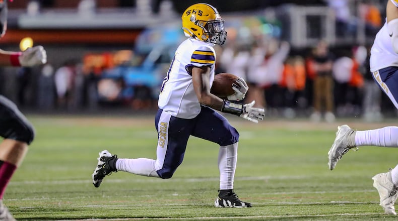 Springfield High School junior Deontre Long runs the ball during their game on Friday night at Beavercreek. The Wildcats won 60-8. Christian Cooper/CONTRIBUTED