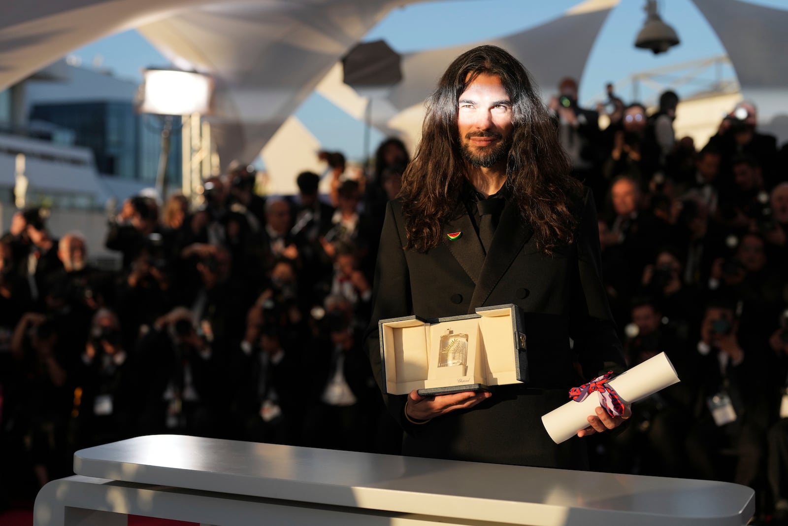Director Oliver Laxe, winner of the jury prize for 'Sirat', poses for photographers at the awards ceremony photo call at the 78th international film festival, Cannes, southern France, Saturday, May 24, 2025. (AP Photo/Natacha Pisarenko)