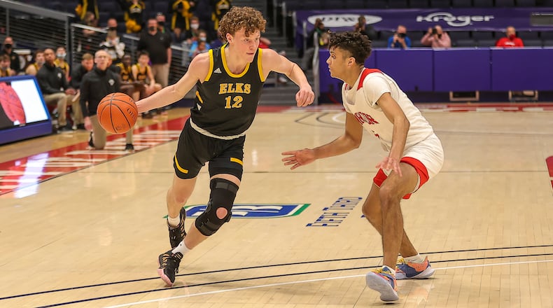 Centerville High School junior Tom House drives past Mentor's Jonah Waag during their game on Saturday night at UD Arena. Michael Cooper/CONTRIBUTED