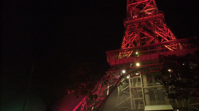 The Eiffel Tower is lit a blood red at Kings Island’s Halloween Haunt. STAFF FILE PHOTO