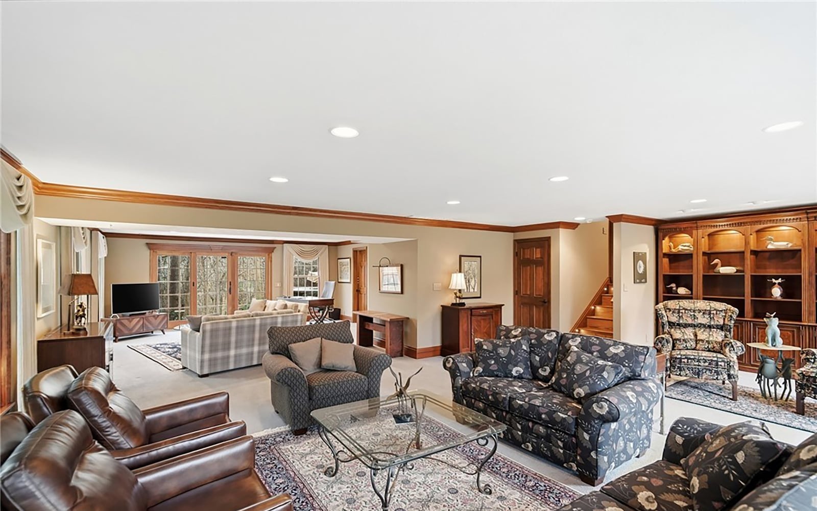 The finished walk out basement features a recreation room with a built in bookcase, recessed lighting, neutral carpeting and a gas fireplace. CONTRIBUTED