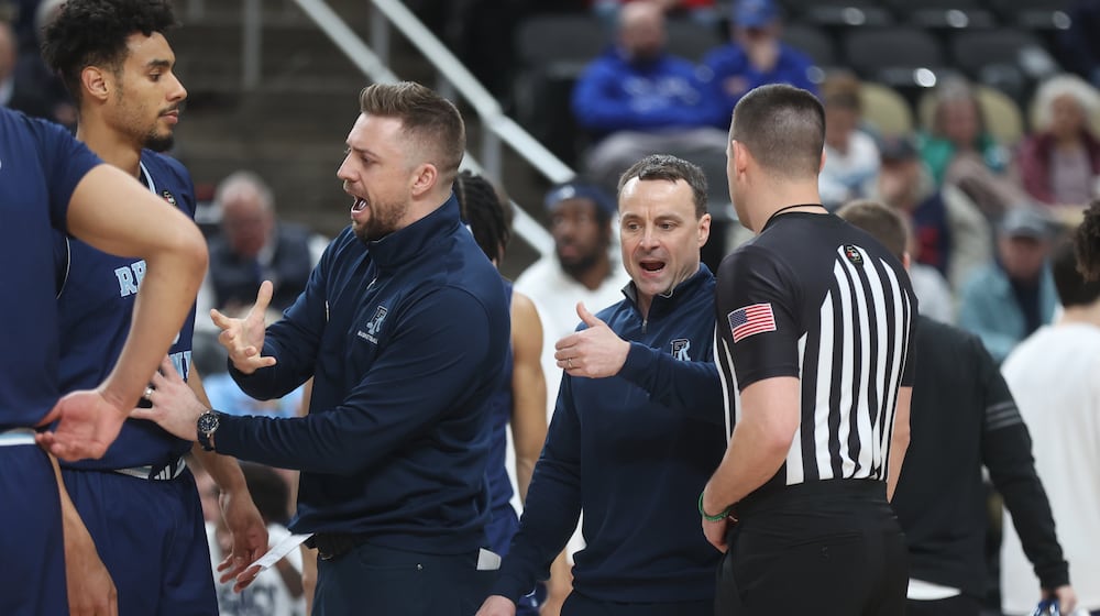 Rhode Island's Archie Miller talks to an official during a game against Duquesne in the second round of the Atlantic 10 Conference tournament on Thursday, March 12, 2026, at PPG Paints Arena in Pittsburgh. David Jablonski/Staff