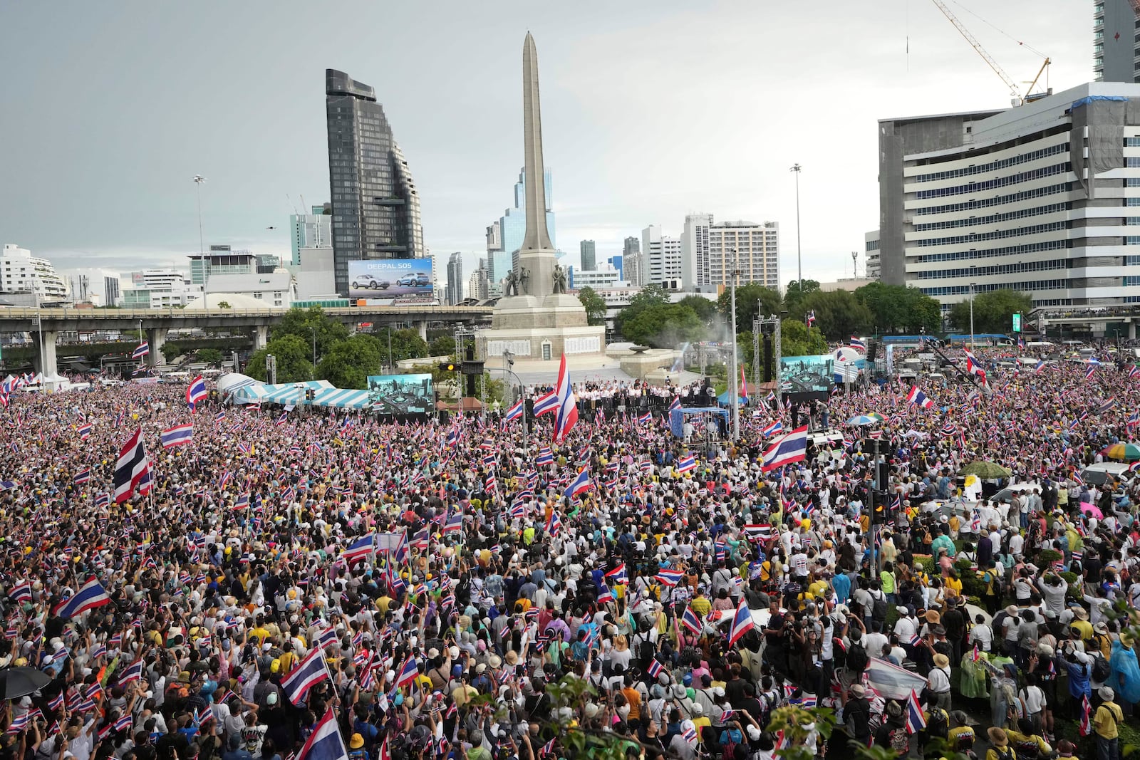 Protesters gather at Victory Monument demanding Thailand's Prime Minister Paetongtarn Shinawatra resign in Bangkok, Thailand, Saturday, June 28, 2025. (AP Photo/Sakchai Lalit)