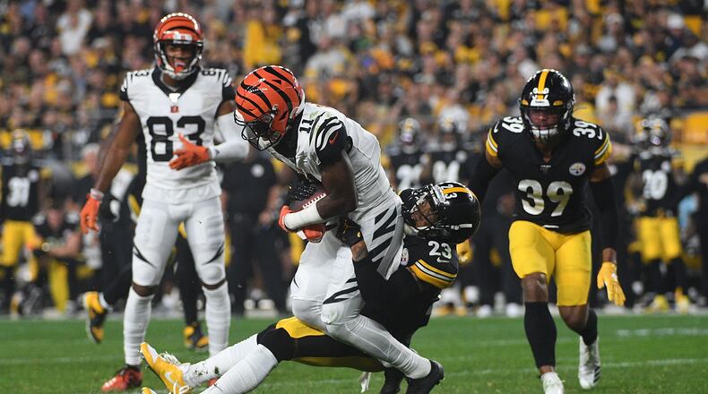 PITTSBURGH, PA - SEPTEMBER 30: John Ross #11 of the Cincinnati Bengals is wrapped up for a tackle by Joe Haden #23 of the Pittsburgh Steelers in the second half during the game at Heinz Field on September 30, 2019 in Pittsburgh, Pennsylvania. (Photo by Justin Berl/Getty Images)