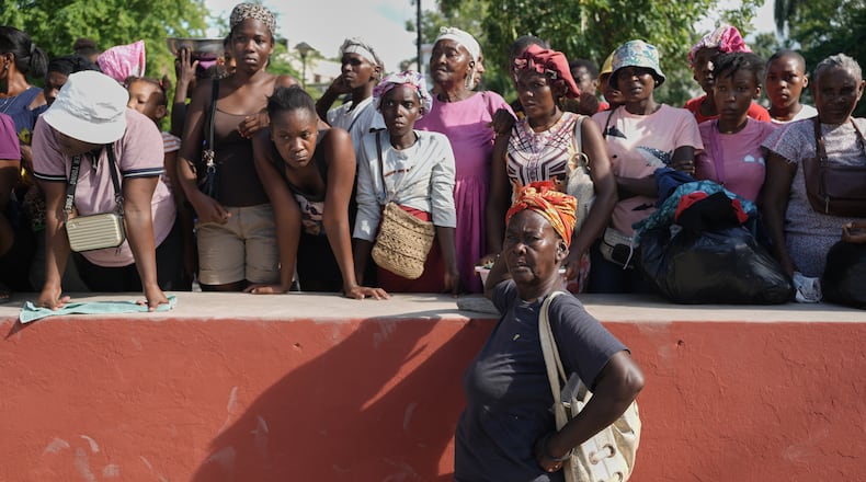 Residents attend the funeral of people killed in a landslide triggered by Hurricane Melissa in Petit-Goave, Haiti, Saturday, Nov. 15, 2025. (AP Photo/Odelyn Joseph).
