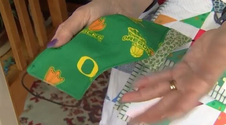 Judit Gebhardt of Washington state said it takes just four pieces of fabric, some thread and a couple of ponytail holders to make a mask cover.