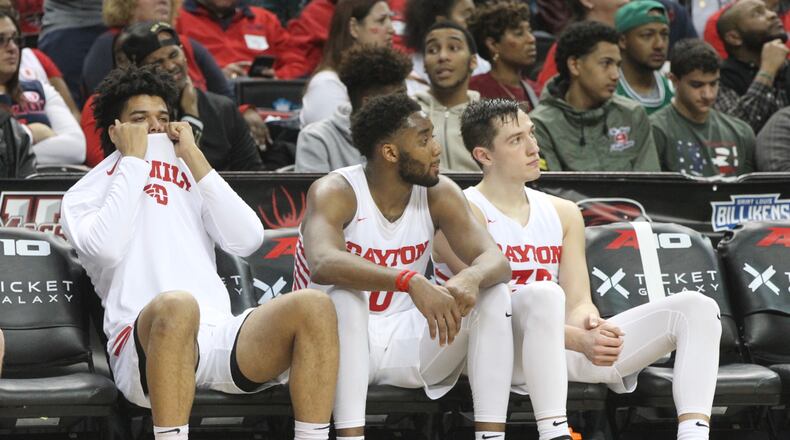 Daytons Frankie Policelli, Josh Cunningham and RyanMikesell watch the final seconds of a loss against Saint Louis in the quarterfinals of the Atlantic 10 tournament on Friday, March 15, 2019, at the Barclays Center in Brooklyn, N.Y. David Jablonski/Staff