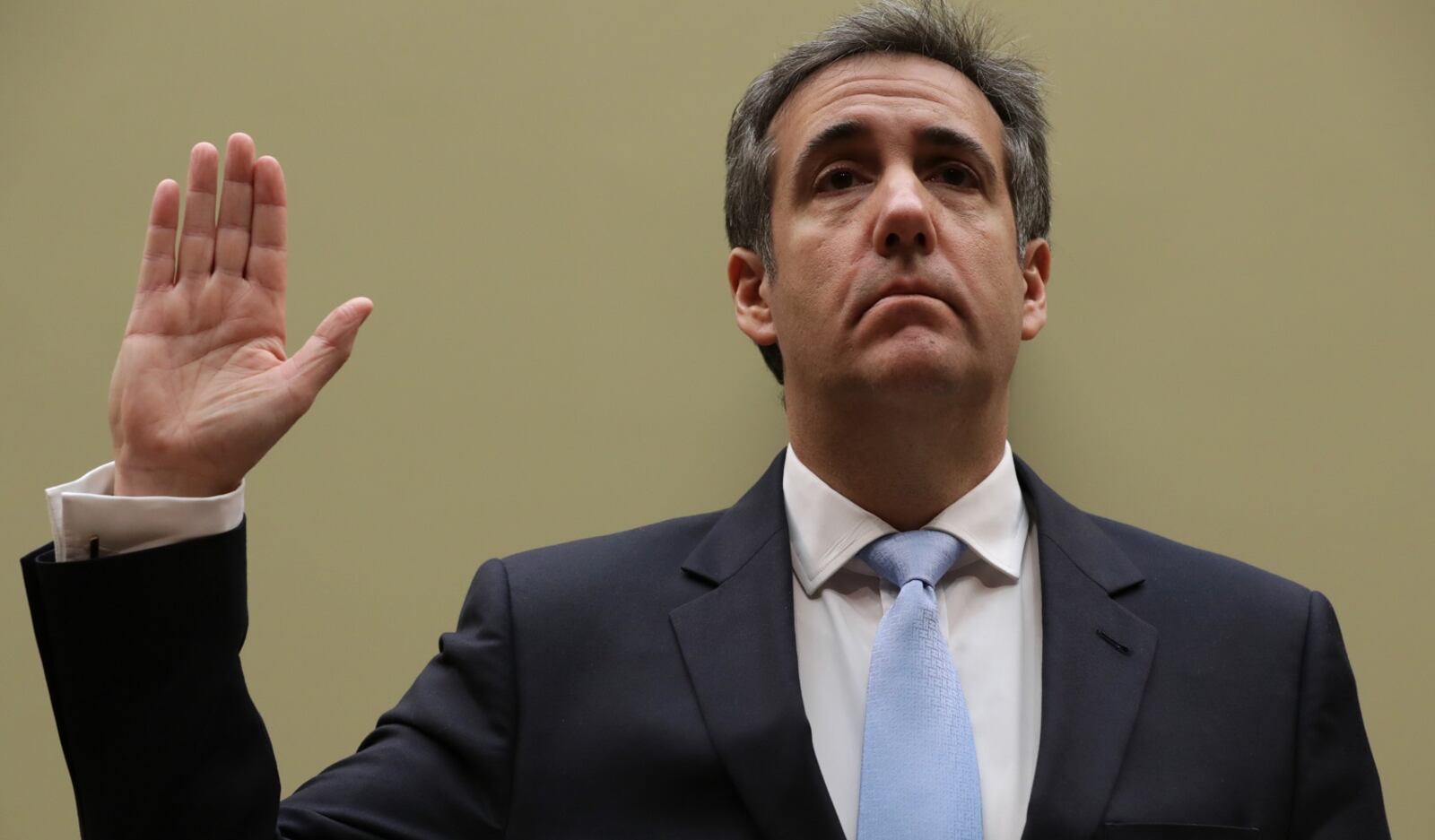 WASHINGTON, DC - FEBRUARY 27: Michael Cohen, former attorney and fixer for President Donald Trump is sworn in before testifying before the House Oversight Committee on Capitol Hill February 27, 2019 in Washington, DC. Last year Cohen was sentenced to three years in prison and ordered to pay a $50,000 fine for tax evasion, making false statements to a financial institution, unlawful excessive campaign contributions and lying to Congress as part of special counsel Robert Mueller's investigation into Russian meddling in the 2016 presidential elections. (Photo by Chip Somodevilla/Getty Images)